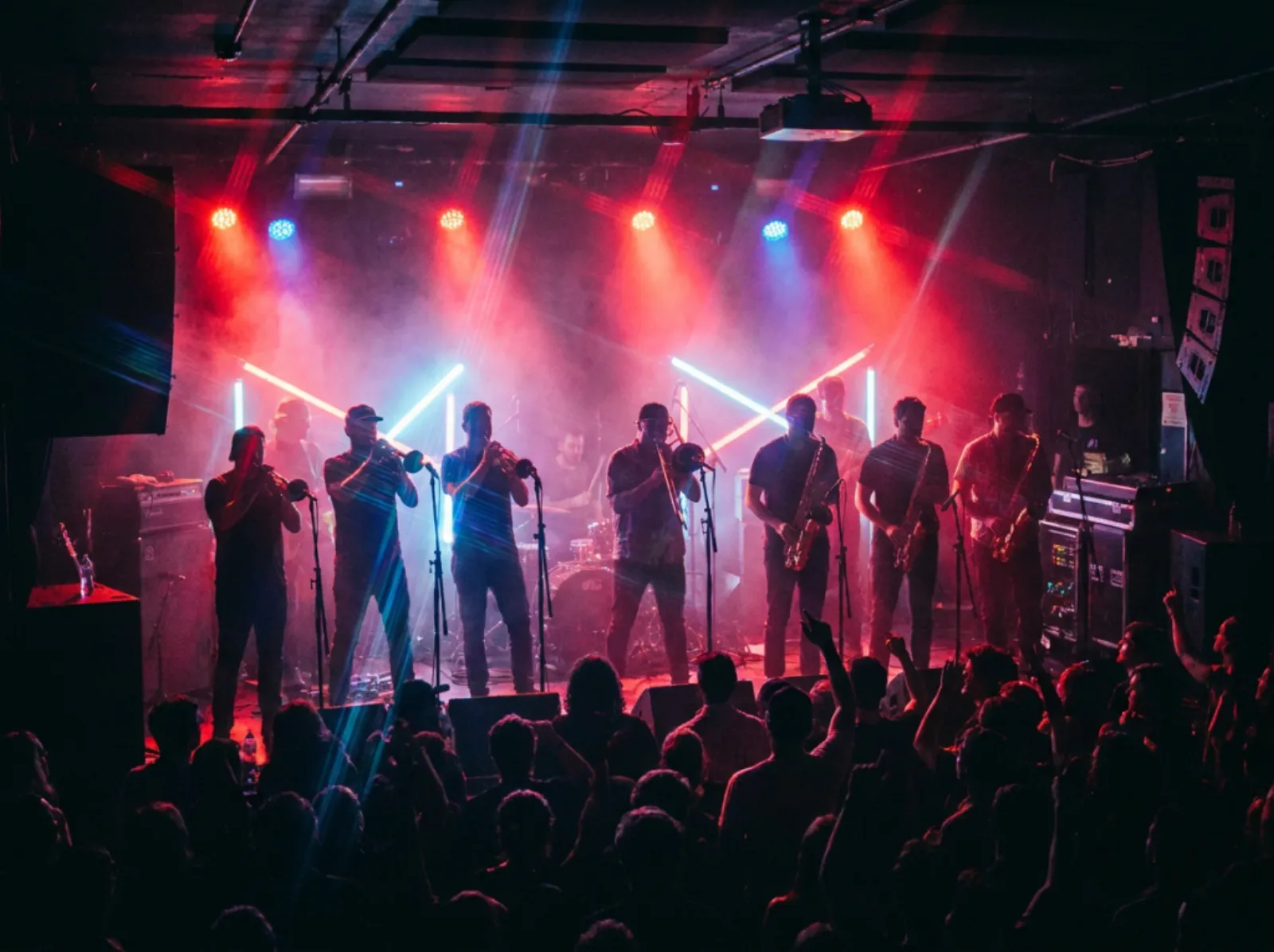 Eight-piece soul and funk band under red and blue stage lighting