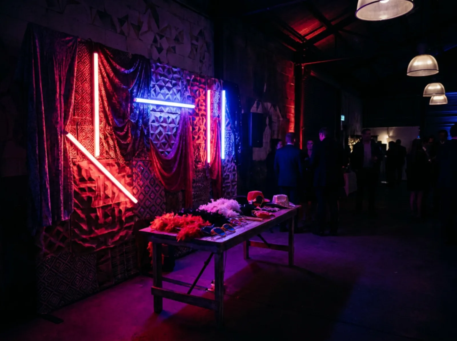 Open photobooth with red and blue neon backdrop
